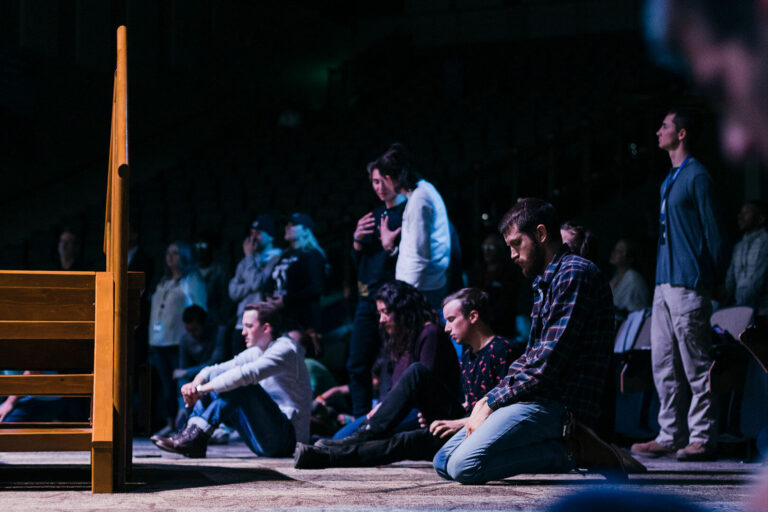 Students Worshipping in Charis Auditorium